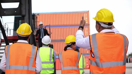 Logistic manager giving public speech and showing support to construction worker at container warehouse. Leader announcing good news. Successful corporate people and business.