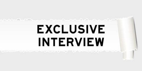 Ripped gray paper background that have word exclusive interview under torn part