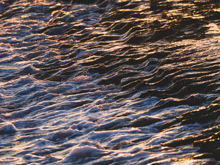 beautiful sea waves at sunset