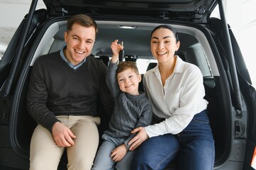family choosing a car in dealership, they want the most comfortable and safe car