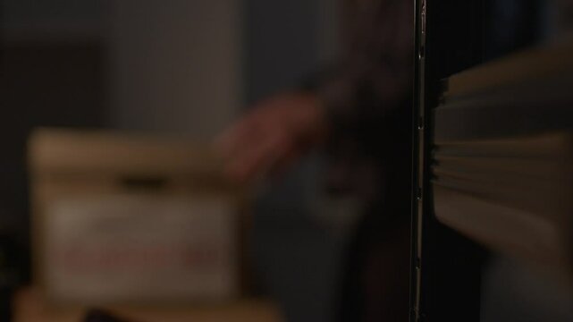 Out of Focus shot of FBI agent Opening Evidence Box