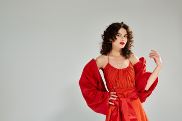 Charming young woman showcasing vibrant summer fashion with confidence and elegance