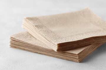 Soft, folded napkins arranged neatly, showcasing texture and sim