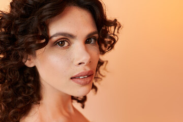 Radiant summer style with a beautiful young woman showcasing her curly hair and natural beauty