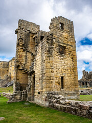 Warkworth Castle, Northumberland, UK with blue and cloudy sky
