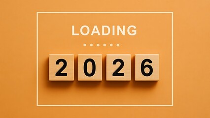 Wooden blocks displaying the number 2026 with the word loading above