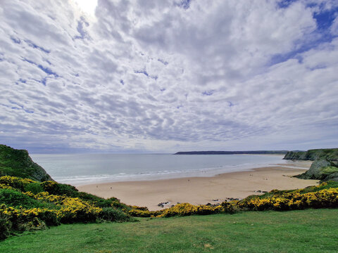 Pobbles Bay Beach near Three Cliffs Bay on the Gower Peninsular West Glamorgan Wales which is a popular Welsh coastline travel destination of outstanding beauty, vacations stock photo image
