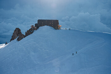 flying view of the Capanna Regina Margherita on the Punta Gnifetti mountain peak in the Alps of...