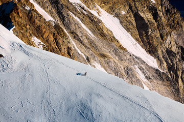 Helicopter flight over snow covered mountains