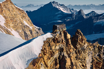 flying view of the Capanna Regina Margherita on the Punta Gnifetti mountain peak in the Alps of Switzerland above Zermatt