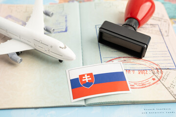 Slovakia flag and passport with airplane for travel.