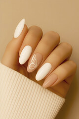 Manicure hand finger nail. White and nude nailart with butterfly design.