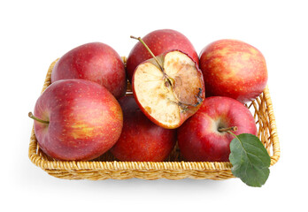 Spoiled apple and good ones in basket isolated on white