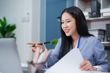 Accountant woman working on financial investment on calculator, calculation, business growth analysis and marketing on graph at office.