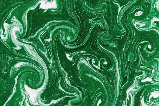 Abstract swirling patterns of emerald green and white paint