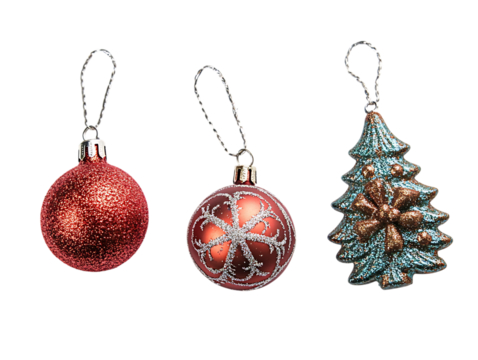 Three glittery christmas ornaments including a red ball and a tree isolated on transparent background