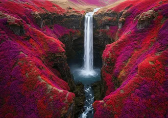 Fototapeten Icelandic waterfall cascading into vibrant pink landscape © Subu.STD