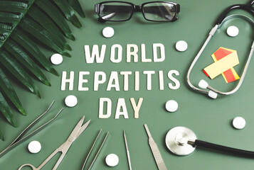 Stethoscope and inscription World Hepatitis Day in mint green.