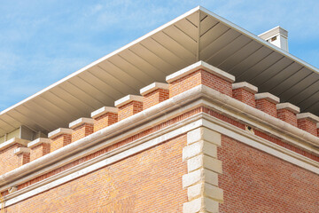 fortress renovated building exterior design brick wall corner shape and metallic roof architectural...