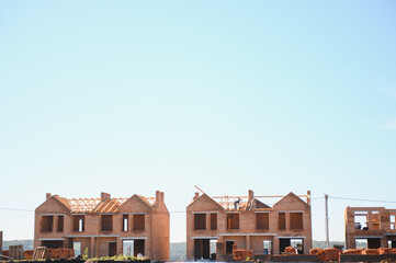 Villa construction. Bricks house under construction. Construction of modern house. Home renovation...