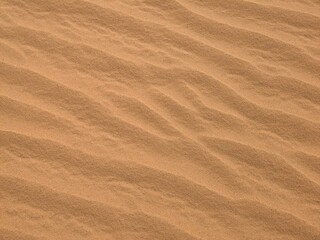 Orange color sand texture pattern background. Wadi Rum desert, Jordan,Arabia scenic beautiful panorama,Close-up of redorange sand on desert