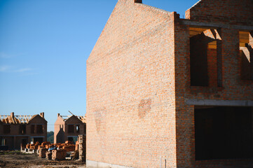 Villa construction. Bricks house under construction. Construction of modern house. Home renovation...