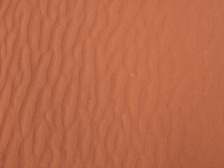 Orange color sand texture pattern background. Wadi Rum desert, Jordan,Arabia scenic beautiful panorama,Close-up of redorange sand on desert