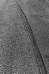 Abstract asphalt street road background with black tire marks on race track, Texture and background car automobile and automotive skid tire marks.