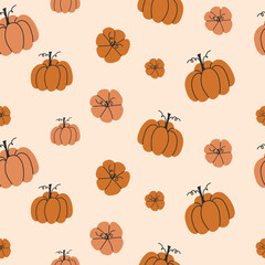 Seamless pattern of hand drawn orange pumpkins in various sizes on a soft beige background in a fall harvest style