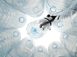 Plastic bottle being disposed of in a recycling bin