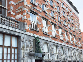 Ljubljana, Slovenia - July 06, 2025: Architectural detail of a historic building featuring a green...