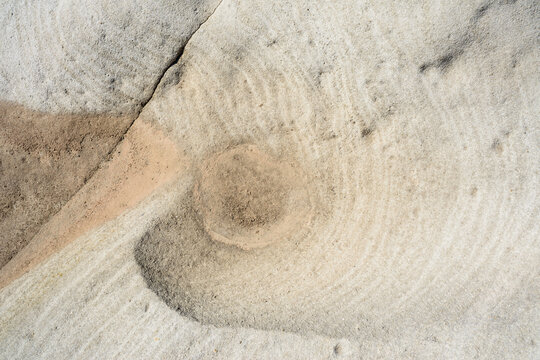 Detail shot of patterned rock in creams and oranges