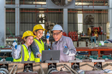 Friendly group of diverse industrial engineers wea yellow safety helmets and reflective vests...