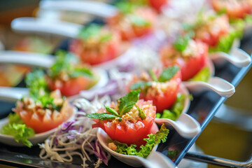 A variety of small spoons holding different types of food