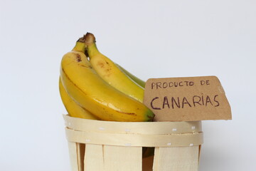 Bunch of bananas in a wooden basket with a 