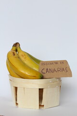 Bunch of bananas in a wooden basket with a 
