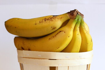 Bunch of bananas in a wooden basket