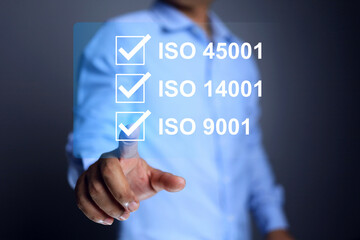 iso basic standard concept with businessman tick checkmark on requirement industrial is environmental, quality, and safety standards represent to complied to requirement