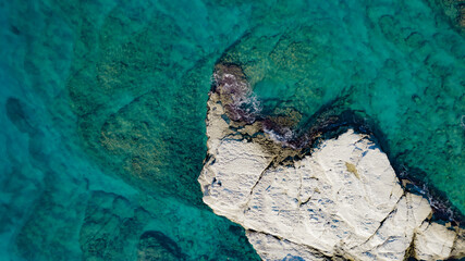Aerial view of white rocky coastline in Syria. Rocks on coast beautiful sea bay at Latakia beach. Natural landscapes by the sea.