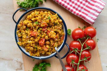 Healthy  chickpea curry with vegetables and basmati rice. Beautiful vegan food background