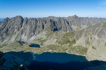 Valley with ponds surrounded by rocky mountain ridges. View in the morning.