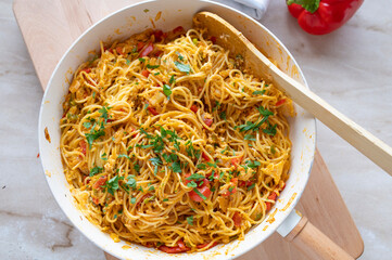 Pan Fried noodles with eggs and vegetables in a frying pan fresh and homemade cooked, 
