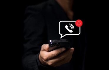 Phone scam alert notification concept. A person holding a smartphone with a digital scam warning notification, fraudulent calls, cybersecurity threats, and telecommunication security awareness. fraud,