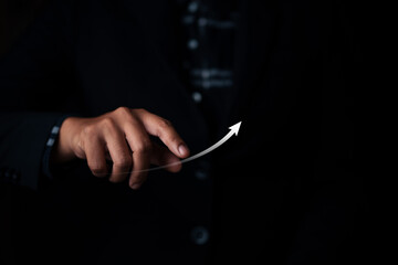Business growth strategies modern office image of a hand pointing upward dark background...