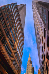 Abstract architectural geometry of New York City skyline with high-rise buildings in Midtown Manhattan, USA — a study in structure, symmetry, and vertical rhythm.