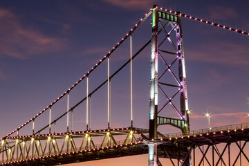 sunset and the main tower of the Hercilio Luz bridge postcard of the city of Florianópolis capital...