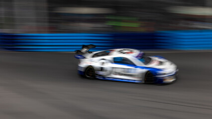 Motion blur race car racing on speed track, Motion blurred super car race on street track circuit,...
