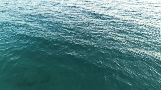 4K Drone Footage of Brela Sea Water with Light Waves and Vibrant Blue Color, Croatia