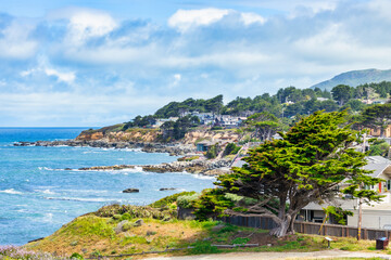 Coastal houses perched above the Pacific Ocean between Devils Slide and the southern stretch of...