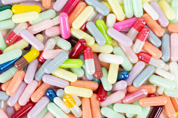 Colorful medicine capsules background. Pharmacy and healthcare concept.